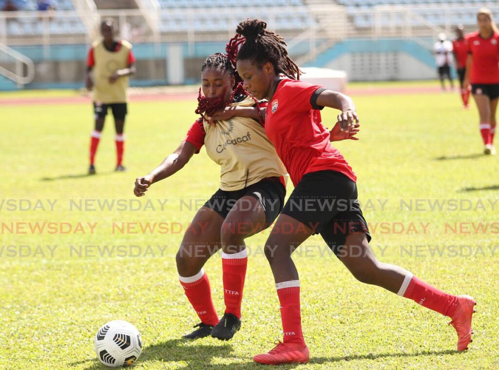 Trinidad and Tobago senior women’s team player Naomie Guerra (R) vies for control of the ball during a match between the senior women’s team and the U20 team, on Saturday, at the Ato Boldon Stadium, Couva. - Lincoln Holder