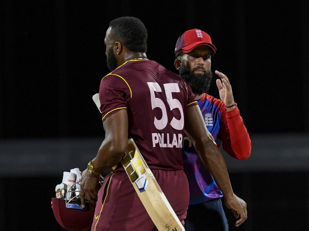 Moeen Ali (R) of England and Kieron Pollard (L) of West Indies are seen at the end of the 4th T20I between West Indies and England at Kensington Oval, Bridgetown, Barbados, on Saturday. - CWI Media