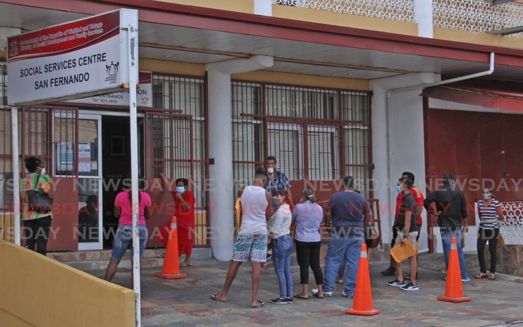 People line up outside the Ministry of Social Development office in San Fernando  to apply for relief grants on April 16, 2020. - File photo