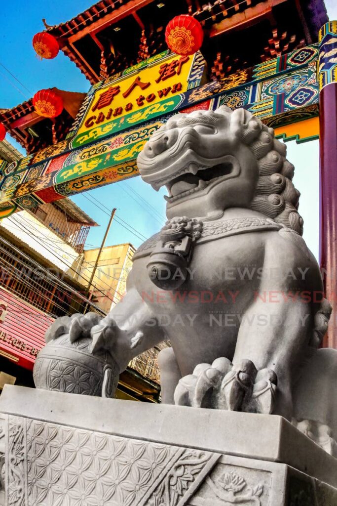 One of the two lion statues now guarding the entrance to Chinatown (Charlotte Street, Port of Spain). The lions were unveiled in 2021 by Chinese Ambassador Fang Qiu and Port of Spain Mayor Joel Martinez. - FILE PHOTO/SUREASH CHOLAI