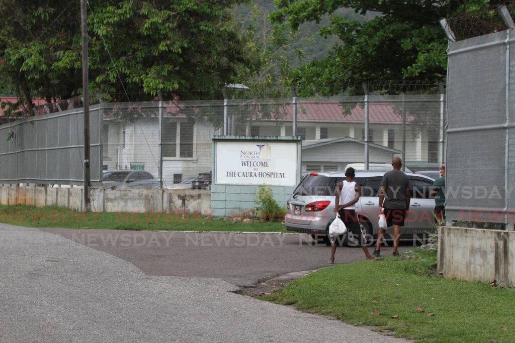 People wait outside Caura Hospital to drop off bags for covid 19 patients on May 12, 2021. - File photo/Marvin Hamilton