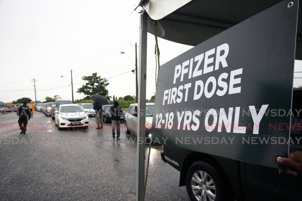 A sign about Pfizer vaccines at the Ato Boldon vaccination site in Couva. - File photo/Lincoln Holder