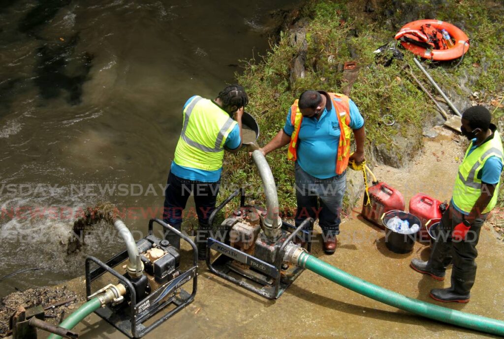 In this file photo, WASA workers do some maintenance work at the North Oropouche Treatment Plant. - AYANNA KINSALE