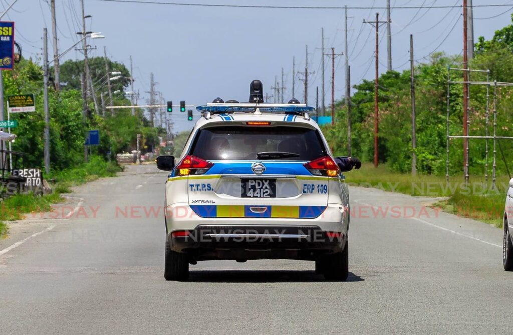 Police on patrol along the Claude Noel Highway in Tobago. - 
