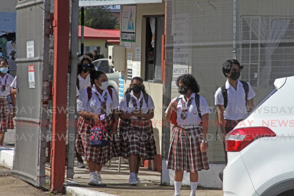 Students leave San Fernando Central Secondary School at the end of a school day in  January. Vaccinations for covid19 will begin in 35 schools from Monday. - PHOTO BY MARVIN HAMILTON