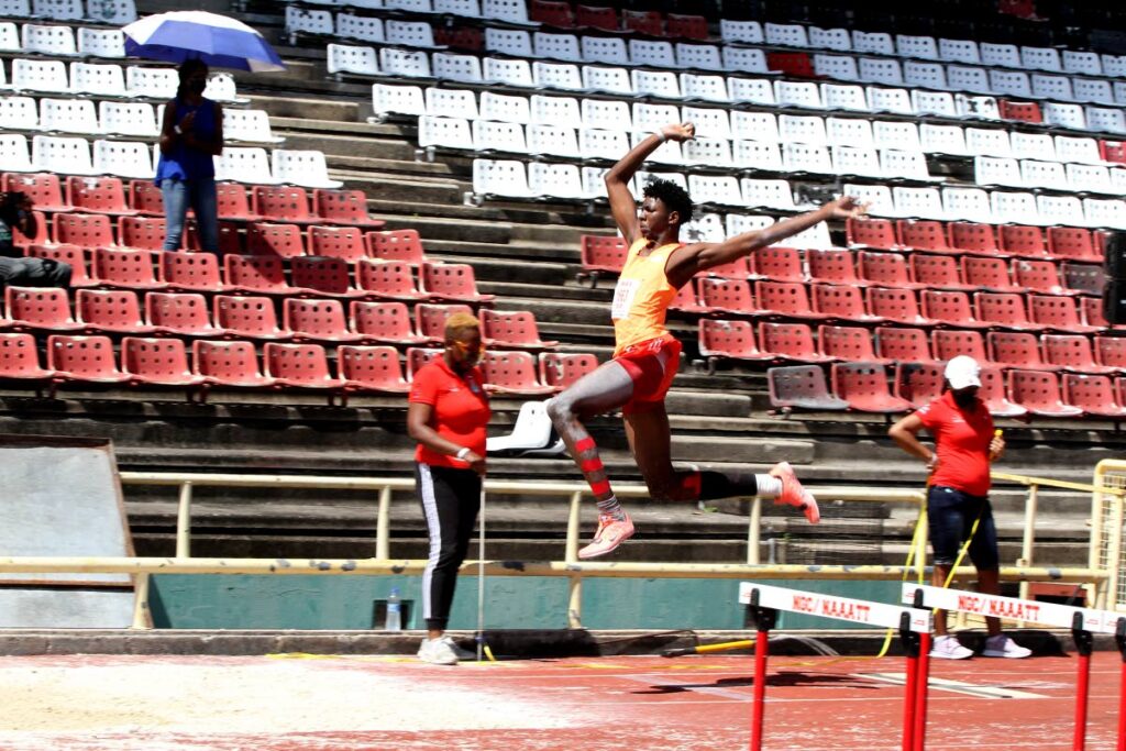 In this photo taken on January 29, Aaron Antoine, of track and field club Neon Wolves, takes part in the Boys Under-20 long jump, at the NAAA’s first meet since Government announced the phased re-opening of sports on January 24, at the Hasely Crawford Stadium, Port of Spain.   - Angelo Marcelle