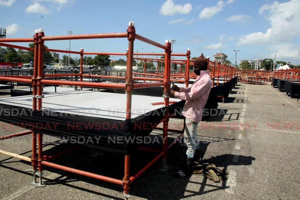 A worker secures one of the 200 pods erected for shows at Queen's Park Savannah, Port of Spain as part of the NCC's Taste of Carnival  - File photo
