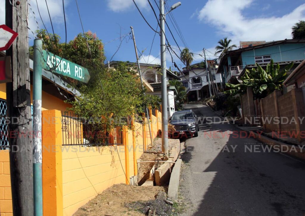 DESERTED: Africa Road in John John, Laventille was deserted on Tuesday morning, hours after a father of three, Dexter Durham, was gunned down. PHOTO BY SUREASH CHOLAI - 