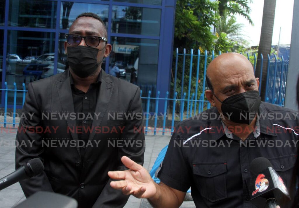 President of the Trinidad and Tobago Automobile Assocaition Visham Babwah, right, speaks to the media alongside vice president Rondell Feeles outside Nicholas Tower, Port of Spain, Tuesday. - Angelo Marcelle