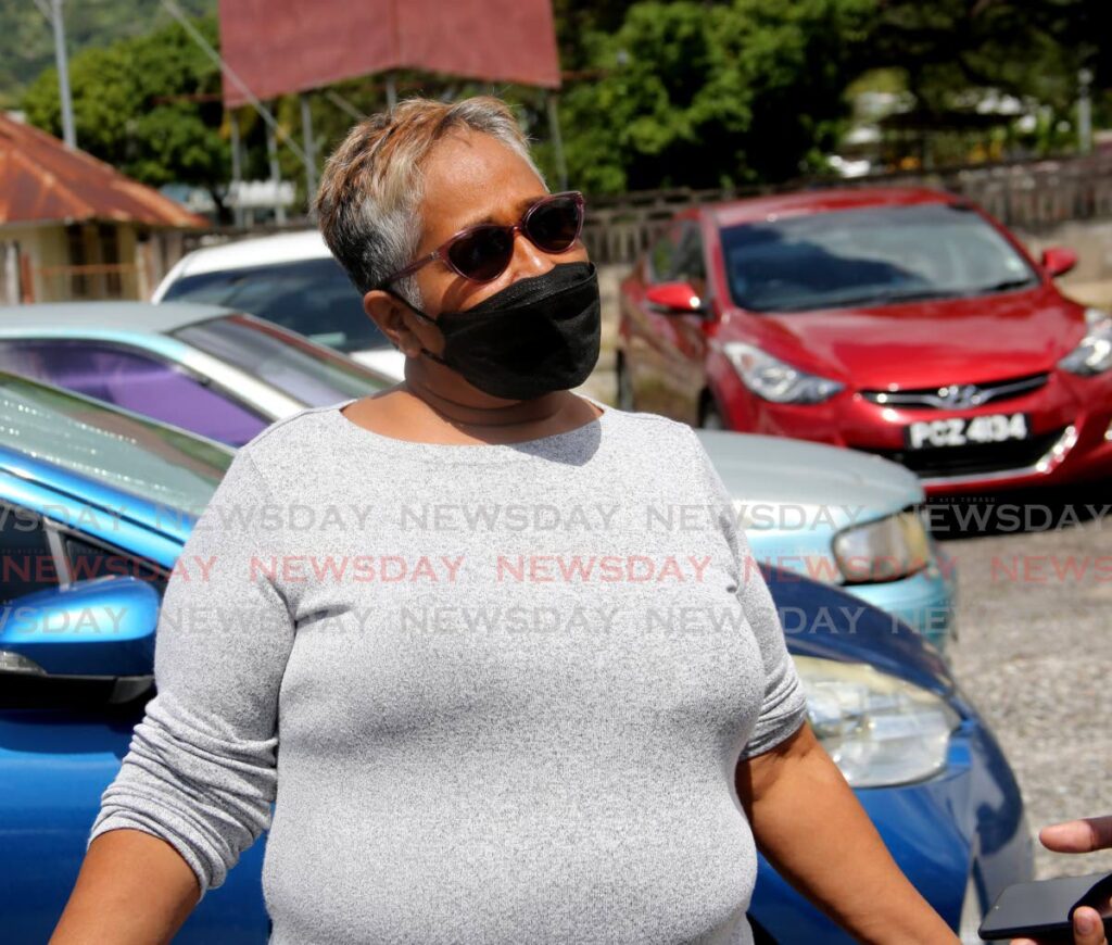 UP TO GOD: Marie Durham speaks outside the Forensic Science Centre in St James on Wednesday. Her son Dexter Durham was gunned down in John John, Laventille on Monday night. PHOTO BY SUREASH CHOLAI - 