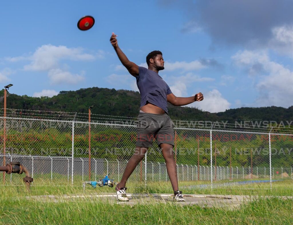 Falcons athlete Christopher Crawford, 20, practises his discus throwing at the Dwight Yorke Stadium, Bacolet on Wednesday. - David Reid