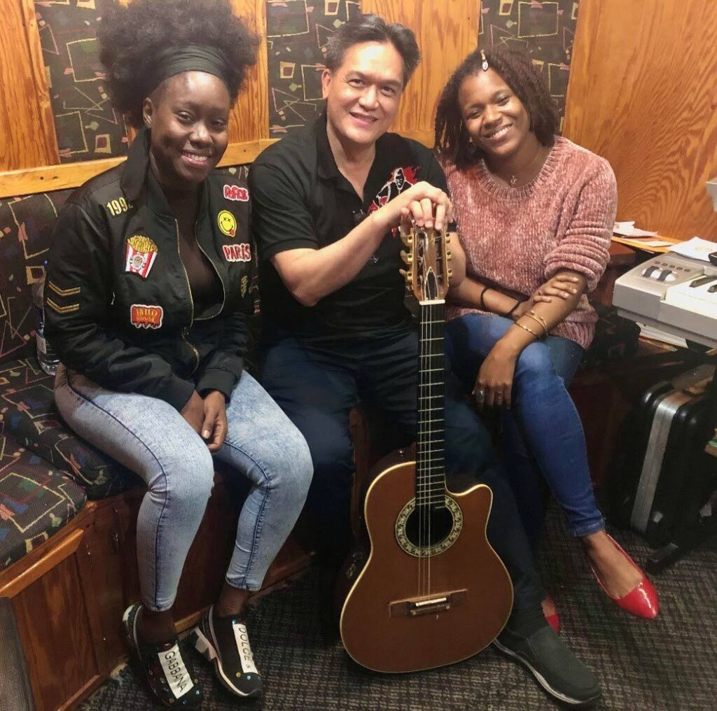 Terri Lyons, left, Mark Loquan and Gerelle Forbes collaborate on Loquan's new song A Better Tomorrow.  - 