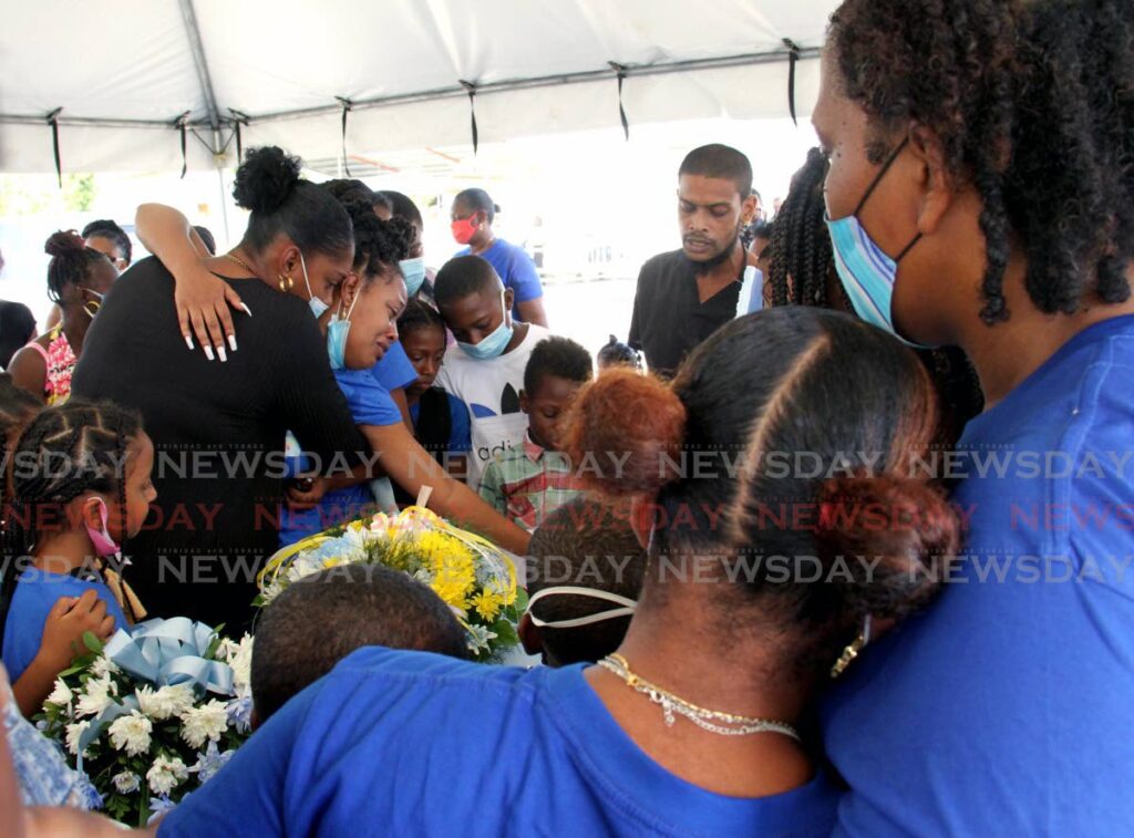 Christian Liverpool's mother Annadel Faria, centre, is overcome with grief. - AYANNA KINSALE