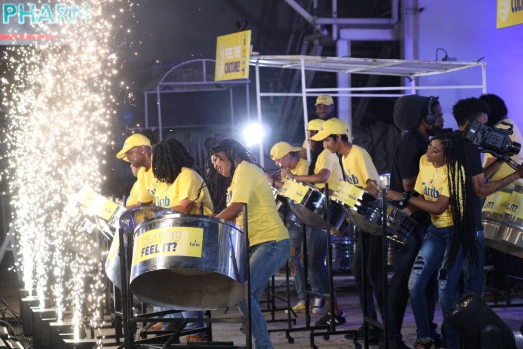 CAL Skiffle steelband plays at the filming of its Panorama video for Carib Brewery Ltd at the band's panyard on Coffee Street, San Fernando. - 