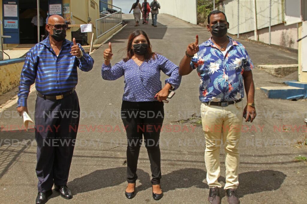 PNM Debe South by-election candidate Judy Sookdeo, centre, leaves the Penal Presbyterian Primary School after visiting the polling station on Monday. Photo by Marvin Hamilton