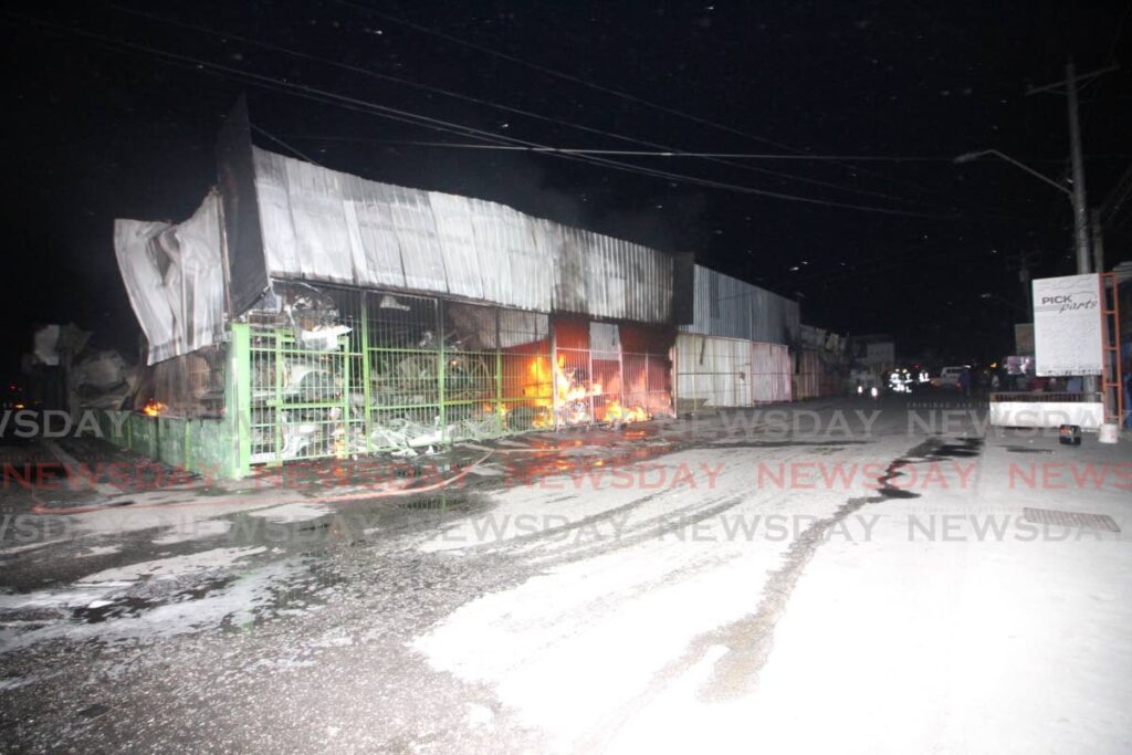 One of the several businesses destroyed in a fire at Bamboo Village #2 on Monday. - Photo by Angelo Marcelle