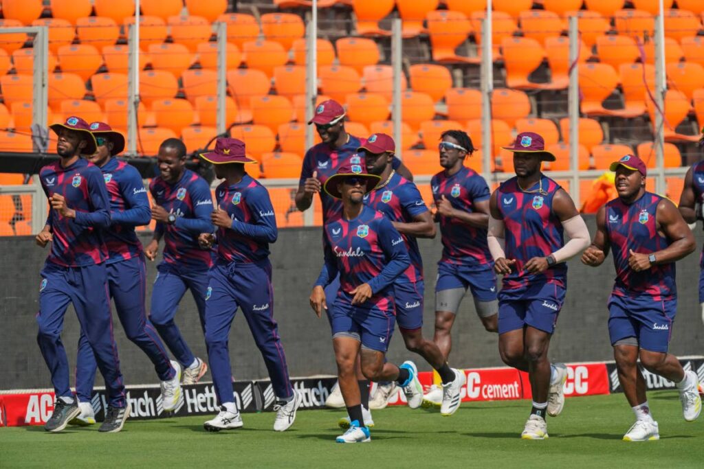 West Indies players run during a practice session ahead of the second one day international against India in Ahmedabad, India, on Tuesday. (AP Photo) - 