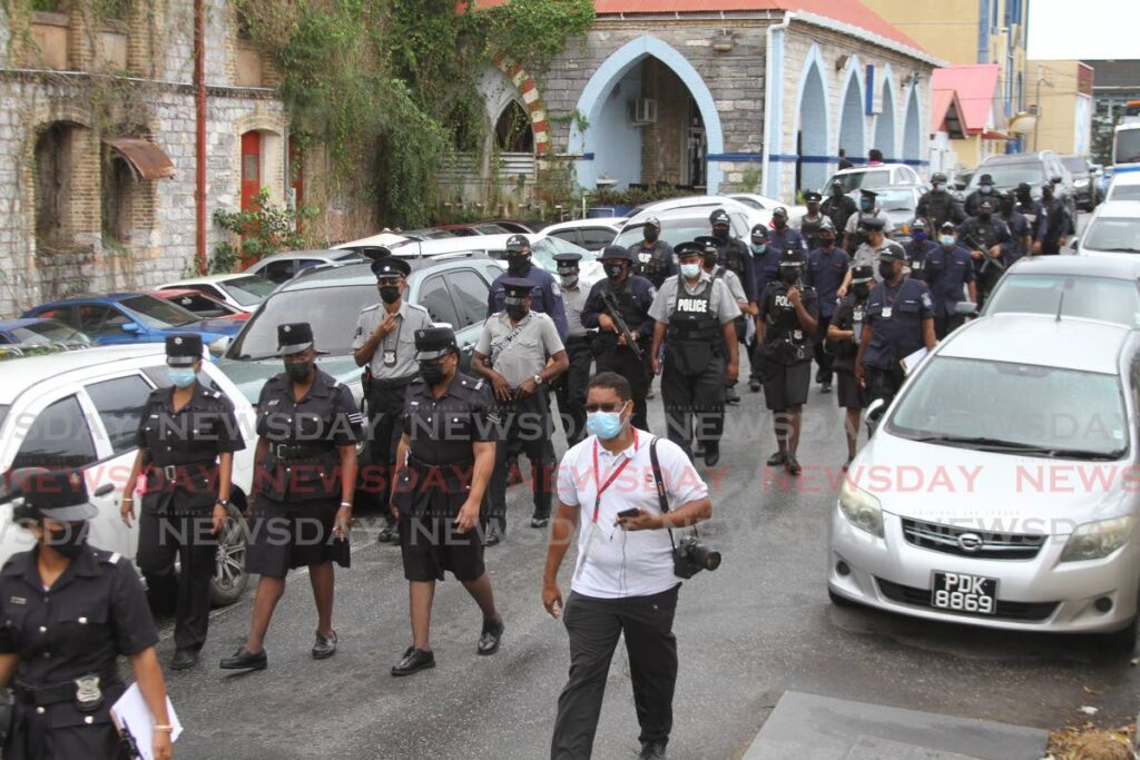 San Fernando police and municipal police in large numbers during a joint anti-crime exercise in the city on Thursday. - Marvin Hamilton