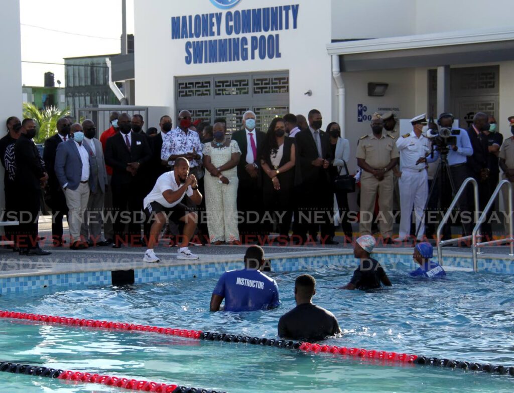 Members of the Trinidad and Tobago Coast Guard perform a fitness routine in the Maloney Community Pool as the PM Keith Rowley, Minister of Planning and Development Camille Robinson-Regis and Minister of Sport and Community Development Shamfa Cudjoe look on, Thursday.  - Ayanna Kisnale