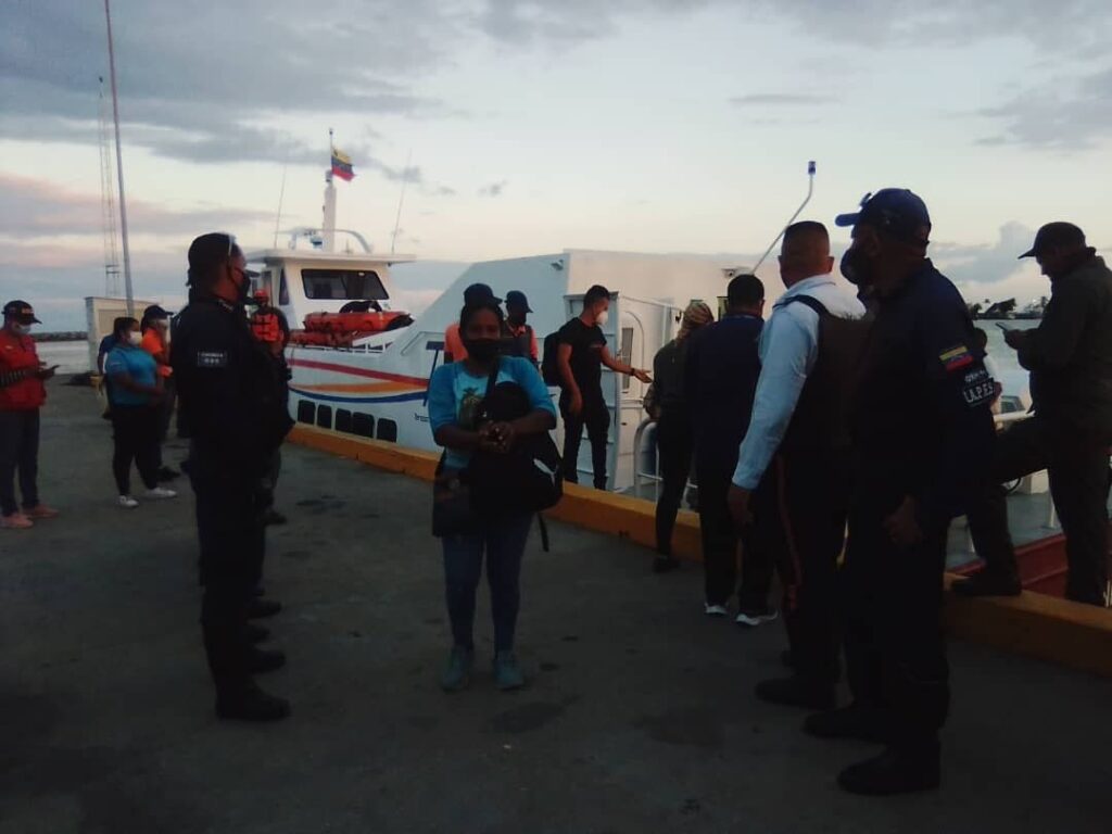 Venezuelan authorities receive 35 Venezuelans deported by the TT Government at Pier No 9, Port of Guiria, Venezuela on Friday evening. The Venezuelans were held as they attempted to enter TT illegally last Saturday night. A one-year-old boy was killed and his mother wounded in the incident. - 