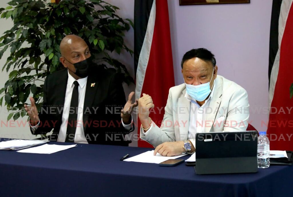 Pointe-a-Pierre MP David Lee, right, makes a point next to UNC Senator Anil Roberts during a press conference on Sunday at the Office of the Opposition Leader in Charles Street, Port of SpaiN. PHOTO BY SUREASH CHOLAI - 