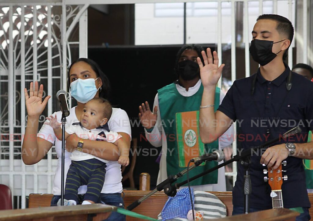 PRAY FOR HIM: Venezuelans pray during a special mass on Sunday in member of one-year-old Venezuelan Ya Elvis Santoyo who was shot dead during an incident involving the Coast Guard on February 5. PHOTO BY ROGER JACOB - 