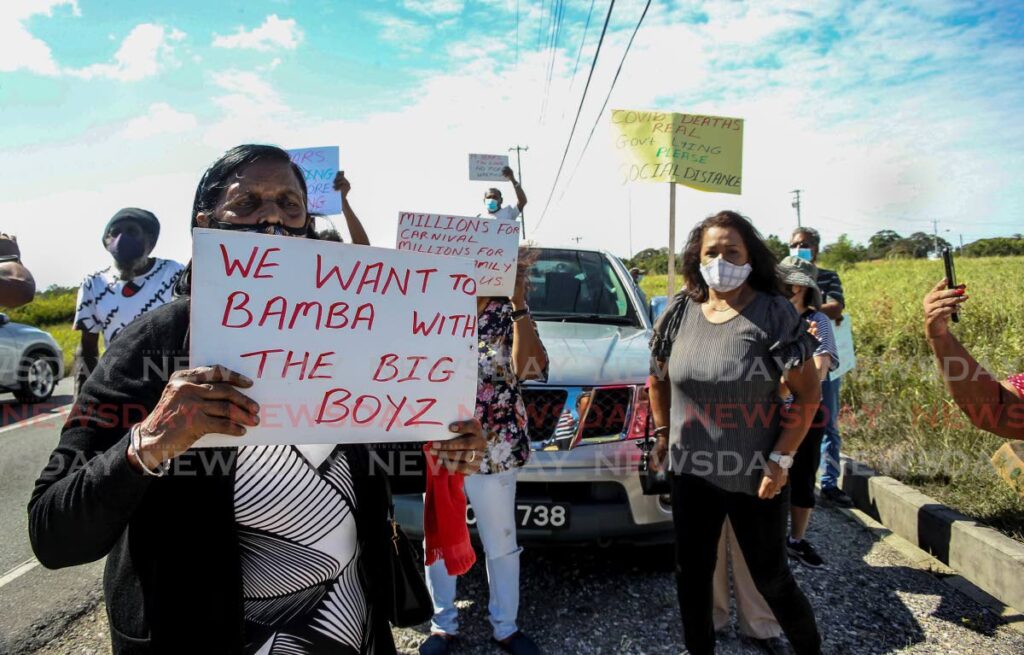Former Caroni Ltd workers protest outside the Brechin Castle Estate, Couva on February 14. - Lincoln Holder