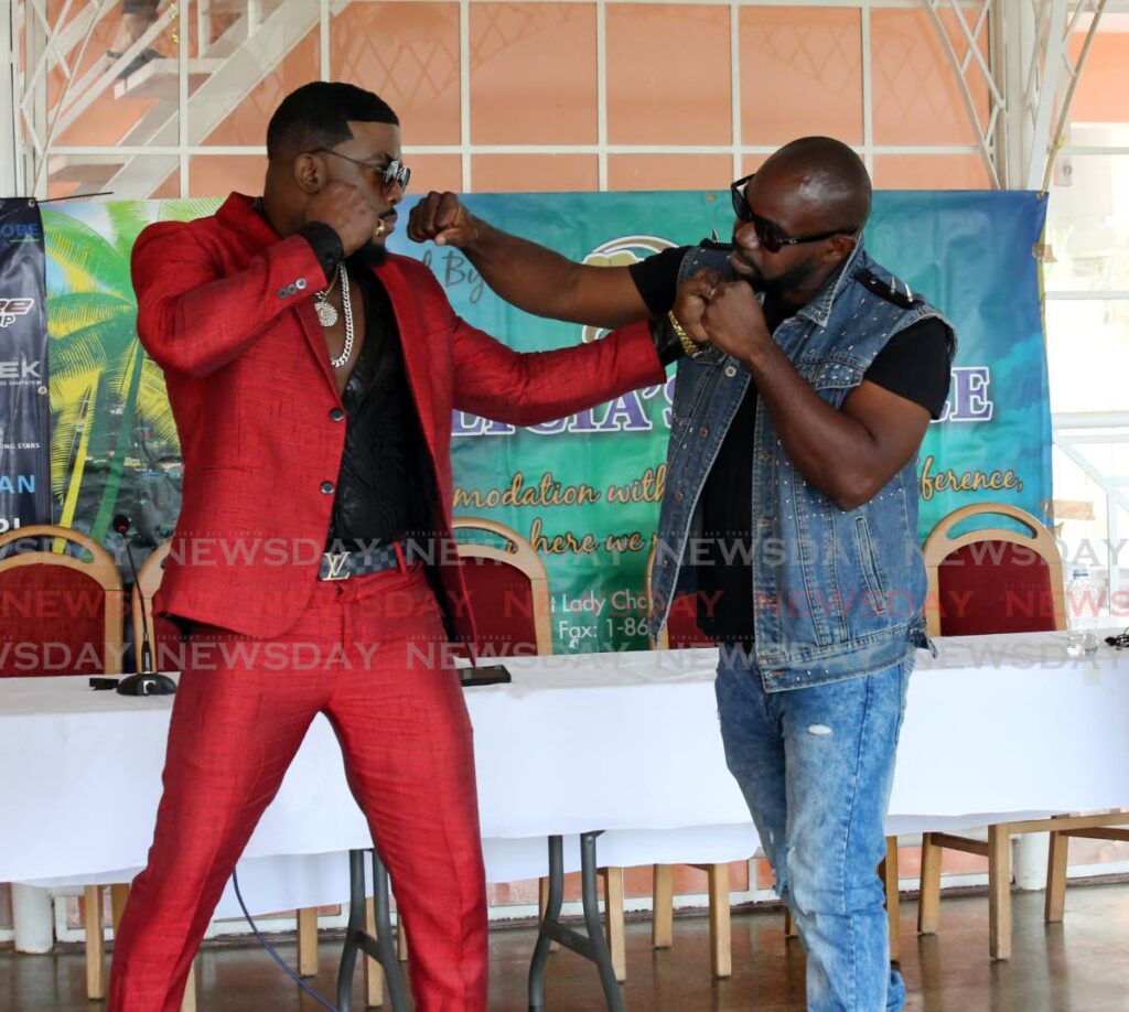 Soca artiste Marvin ‘ Swappi’ Davis (L) and TT dancehall entertainer Anthony ‘ Squeezy Rankin’ La Fluer face off during the unveiling of their celebrity boxing match card at Alicia’s Palace Guest House, Lady Chamcellor Road, Port of Spain, on Tuesday.  - SUREASH CHOLAI