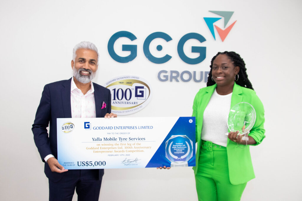 Ainsley Rajkumar, Cluster GM South Caribbean of GCG Group, presents award to Ms. Nalanee Jones, Owner of Yalla Mobile Tyre Services on February 10, 2022.