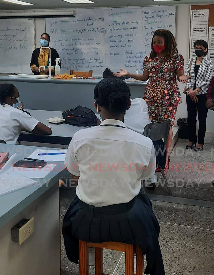 Education Minister Dr Nyan Gadsby-Dolly speaks with students during her tour of schools in the northeastern district on Tuesday. - 