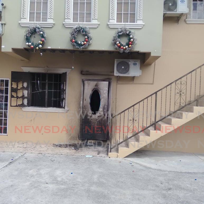 FIRE SCENE: The ground floor of a Curepe building where sisters Amanda and Alicia Charles lived. 
Both sisters died following a fire on Thursday. PHOTO BY SHANE SUPERVILLE  - 
