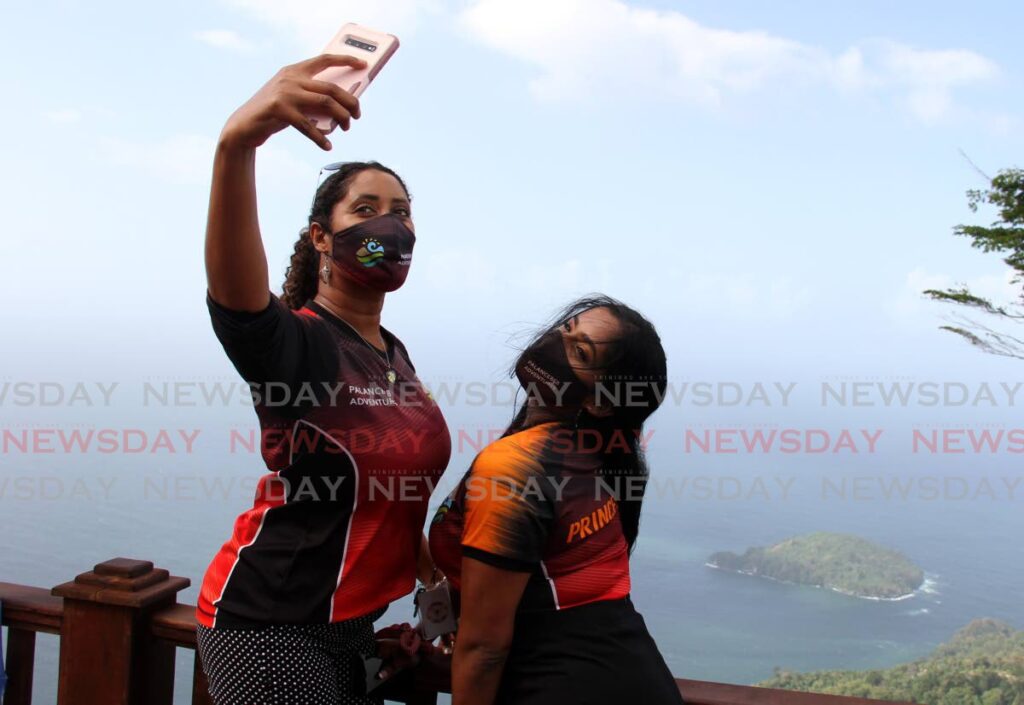 In this file photo Melissa Ramnarine, left, and Maria De Souza take a selfie at the La Vigie Lookout, Paramin. Photo by Ayanna Kinsale