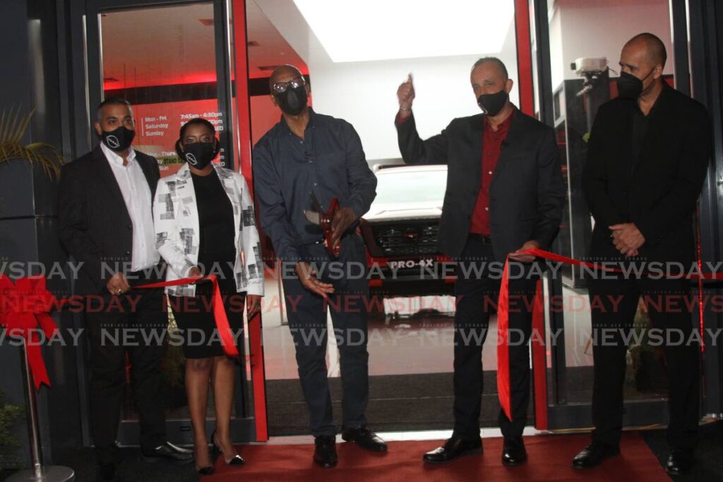 WE'RE OPENED: From left, Massy Motors sales manager Amrit Maharaj, brand manager Sindy Chandler, San Fernando Mayor Junia Regrello, Massy Motors senior VP Jean-Pierre de Coudray and AVP Kyle Wynyard at the opening on Thursday of the company's new showroom in Cipero Street, San Fernando. PHOTO BY MARVIN HAMILTON - 