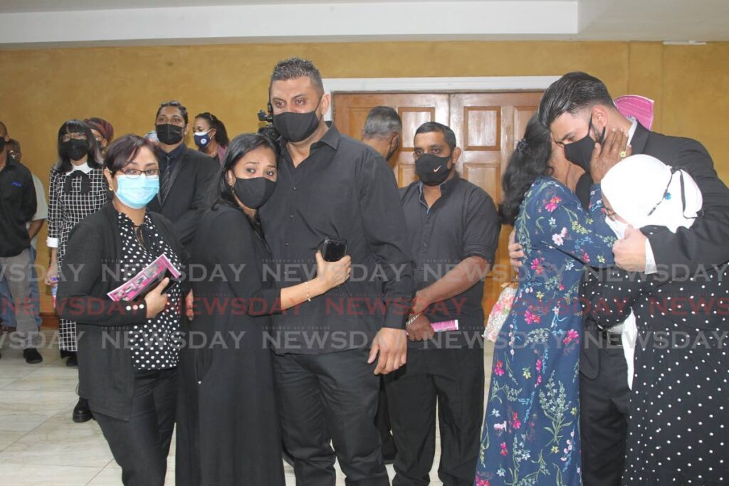 SORROW: Relatives of murder victim Andy Macias Hosein at his funeral on Friday at the Belgroves Funeral Home chapel in Coffee Street, San Fernando. PHOTO BY ROGER JACOB - 