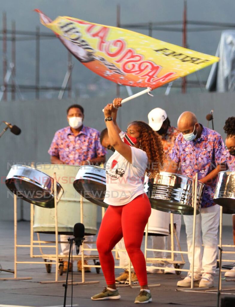 Marsicans Steel Orchestra flag waver Cindy Rosemin performs with the single pan band at Pan in D Sancoche, Carnival City, Queen's Park Savannah, Port of Spain on Saturday. - Angelo Marcelle