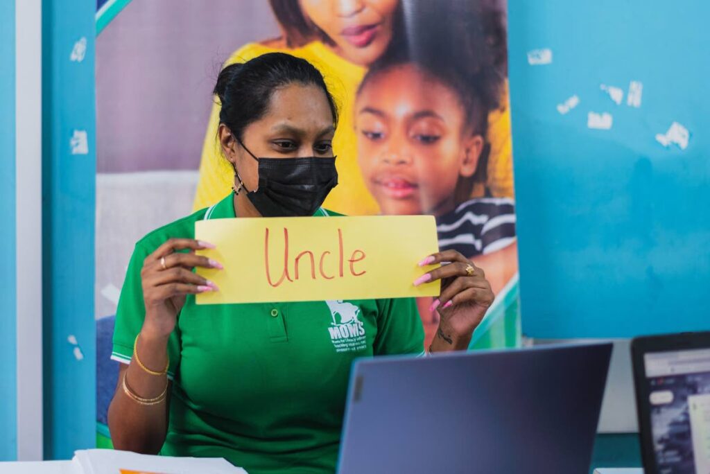 TEACHING: Deepavali Boodram, programme assistant and tutor at MOMS for Literacy - one of several youth literacy NGOs which received assistance from the Scotiabank Foundation, is seen during an online session with primary school students. PHOTO COURTESY SCOTIABANK - Scotiabank