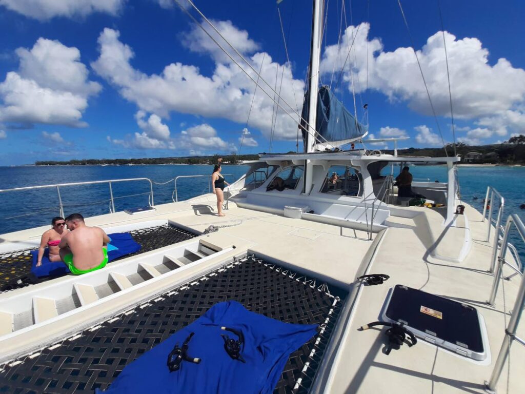 Tiami Catamaran takes visitors into specific areas for snorkelling and swimming with turtles. - Shivonne Peters