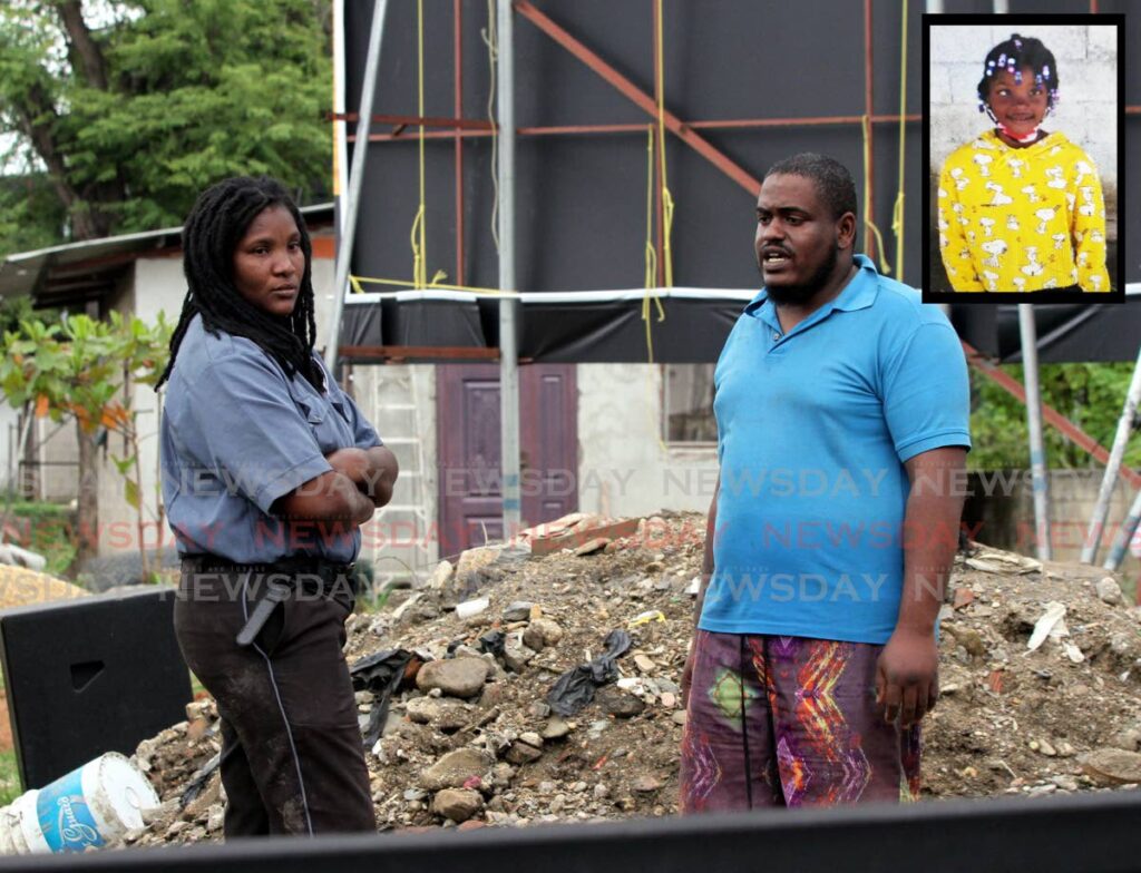 SHE'S GONE: Makeba Mc Intosh, mother of nine-year-old Aneilia Butler (INSET) speaks with a man hours after her daughter perished in a fire at her Beetham Gardens home on Wednesday. PHOTO BY ANGELO MARCELLE - 