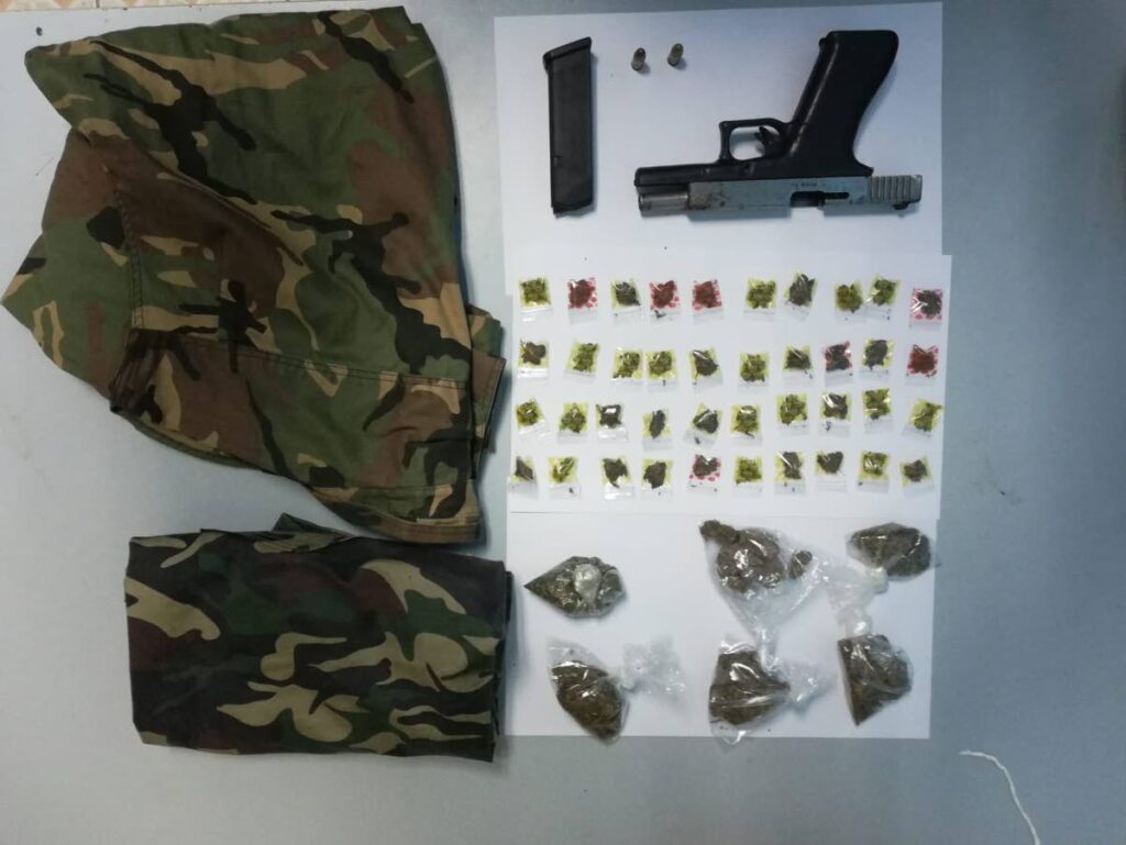 Camouflage clothing, a quantity of marijuana, a pistol and two rounds of ammunition were found and seized by police at a house on El Socorro. 

PHOTO COURTESY TTPS - PHOTO COURTESY TTPS