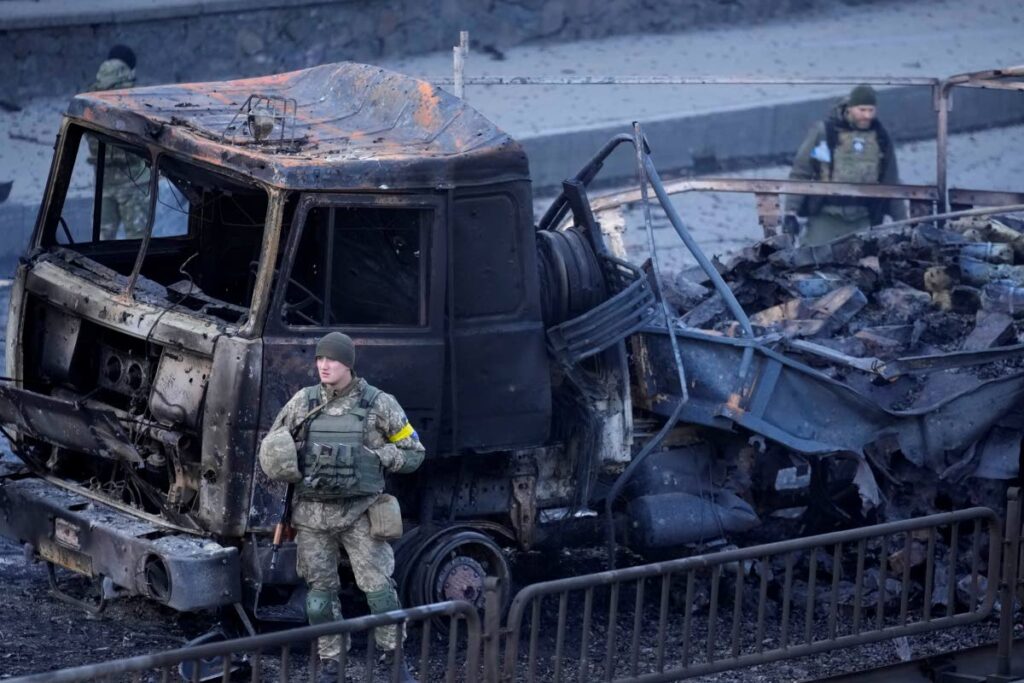Ukrainian troops inspect the site following a Russian airstrike in Kyiv, Ukraine, on Saturday. - AP Photo