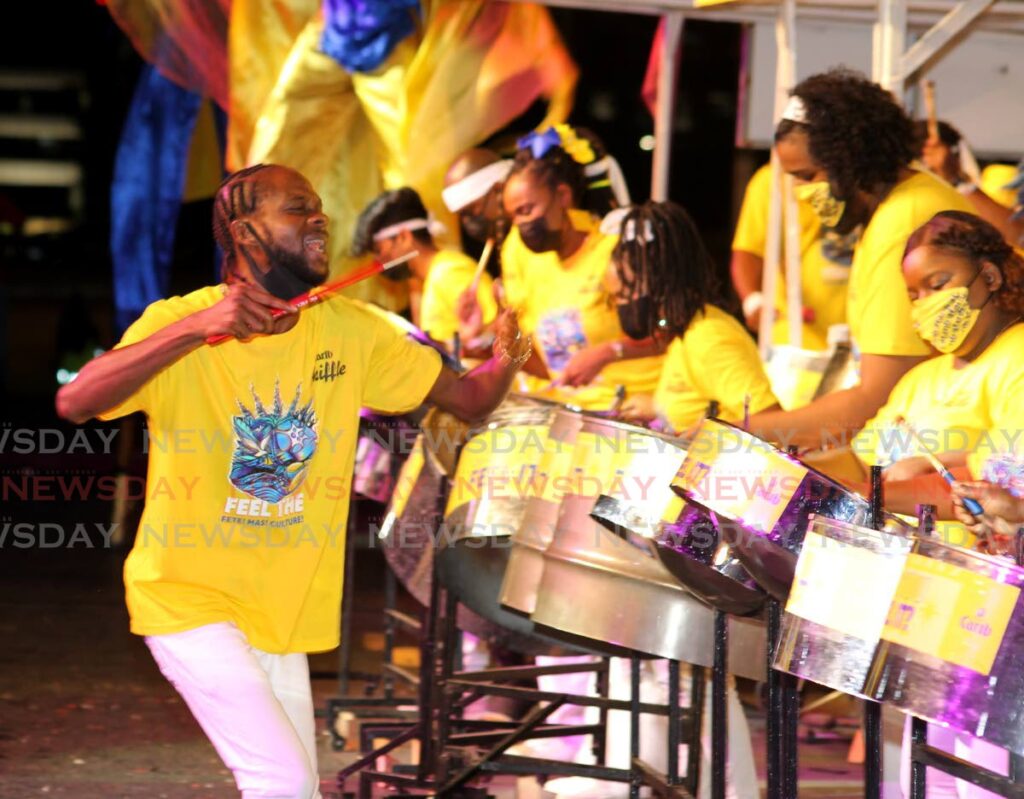 Carib Skiffle Steel Orchestra gives its all. - ROGER JACOB