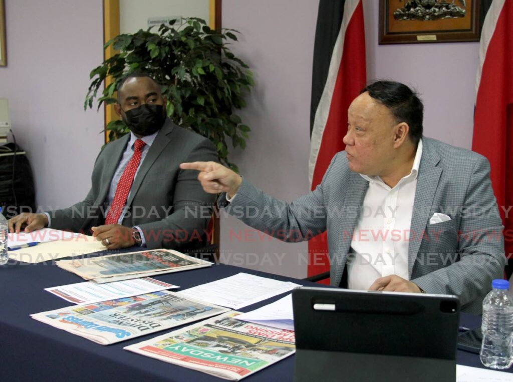 Pointe-a-Pierre MP David Lee gesticulates during the Opposition's weekly news conference at the Office of the Opposition Leader's office at Charles Street, Port of Spain on Sunday. With him is attorney Sean Sobers. - AYANNA KINSALE