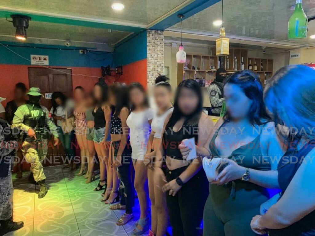 In this file photo, a group of Venezuelan women after they were detained police and the Counter Trafficking Unit at a brothel in Cunupia. - 