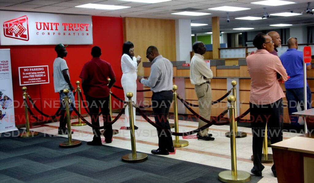 Customers at the Unit Trust Corporation in Port of Spain. - FILE PHOTO/SUREASH CHOLAI