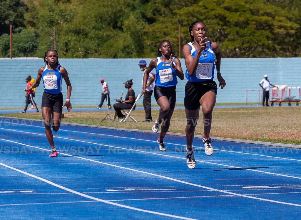 Alexxe Henry (right) of Zenith, on her way to victory in the girls Under-17 100 metres during the National Association of Athletics Administrations (NAAA) 2022 second preparation meet, at the Dwight Yorke Stadium, Bacolet. FILE PHOTO - 