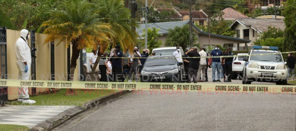 Crime scene tape cordons off the area where a home invasion left three persons dead – two suspects and homeowner Nicole Moses – in Westmoorings on February 22. - SUREASH CHOLAI
