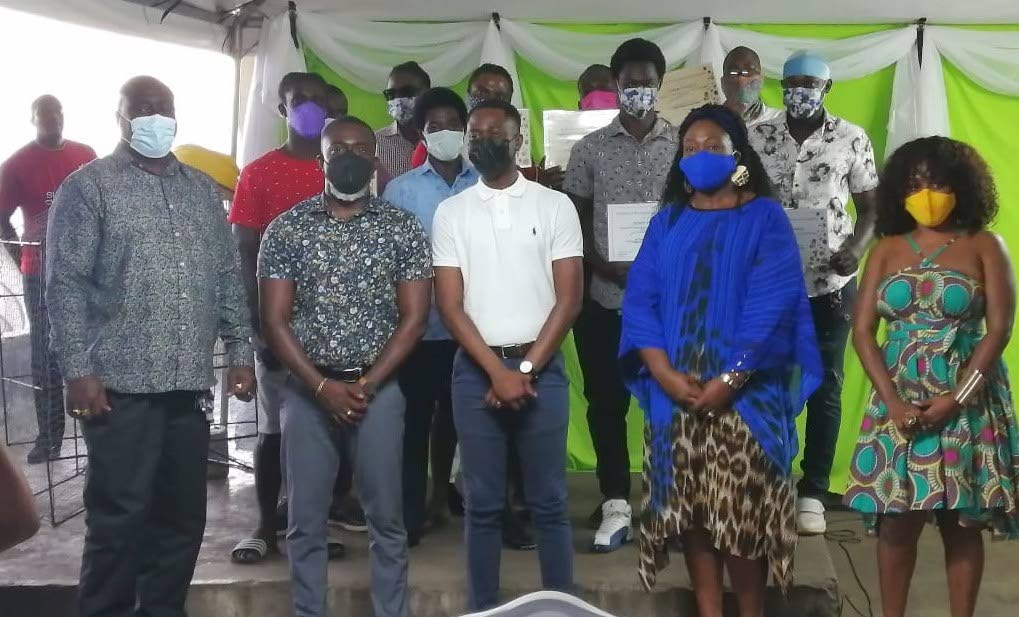Chief Secretary Farley Augustine, front centre, with graduates and other officials at Sunday's All Tobago Fisherfolk Association apprenticeship graduation ceremony on Sunday. - 