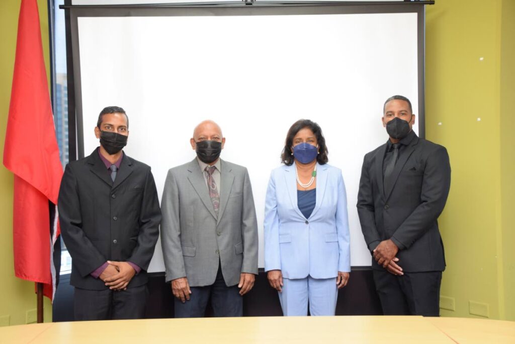 Trade and Industry Minister Paula Gopee-Scoon (centre) along with grant fund recipients, Damian Alexis, managing director, Pinguino Purified Water Limited (right); Darryl Ramnath, general manager, Caribbean Adhesives and Chemicals Ltd and Errol Ramnath, managing director Caribbean Adhesives and Chemicals Limited (left) at the cheque handover ceremony. - Courtesy the Ministry of Trade and Industry