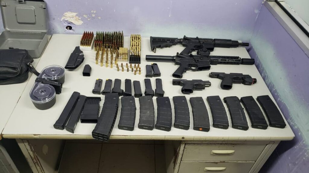 The cache of weapons retrived by officers of the Inter Agency Task Force and Canine Unit during a search of a house in Laventille on Saturday night.  - 
