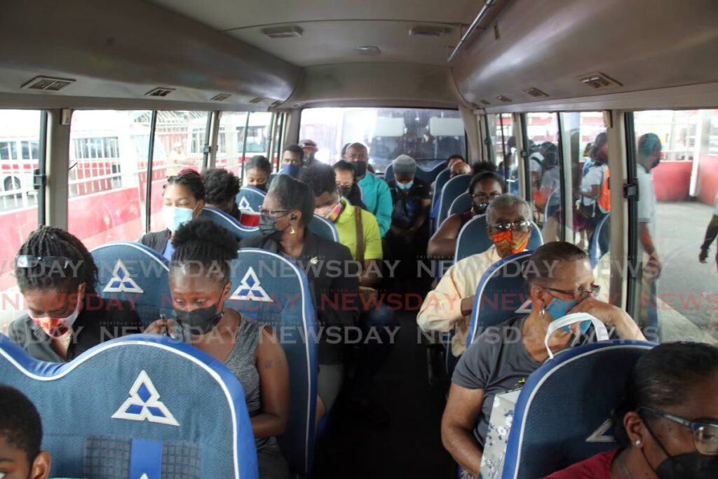 A maxi taxi full of passengers at City Gate, Port of Spain on Monday. All public servants returned to work as part of a resumption of full government services. Public transport also returned to full capacity. - PHOTO BY SUREASH CHOLAI